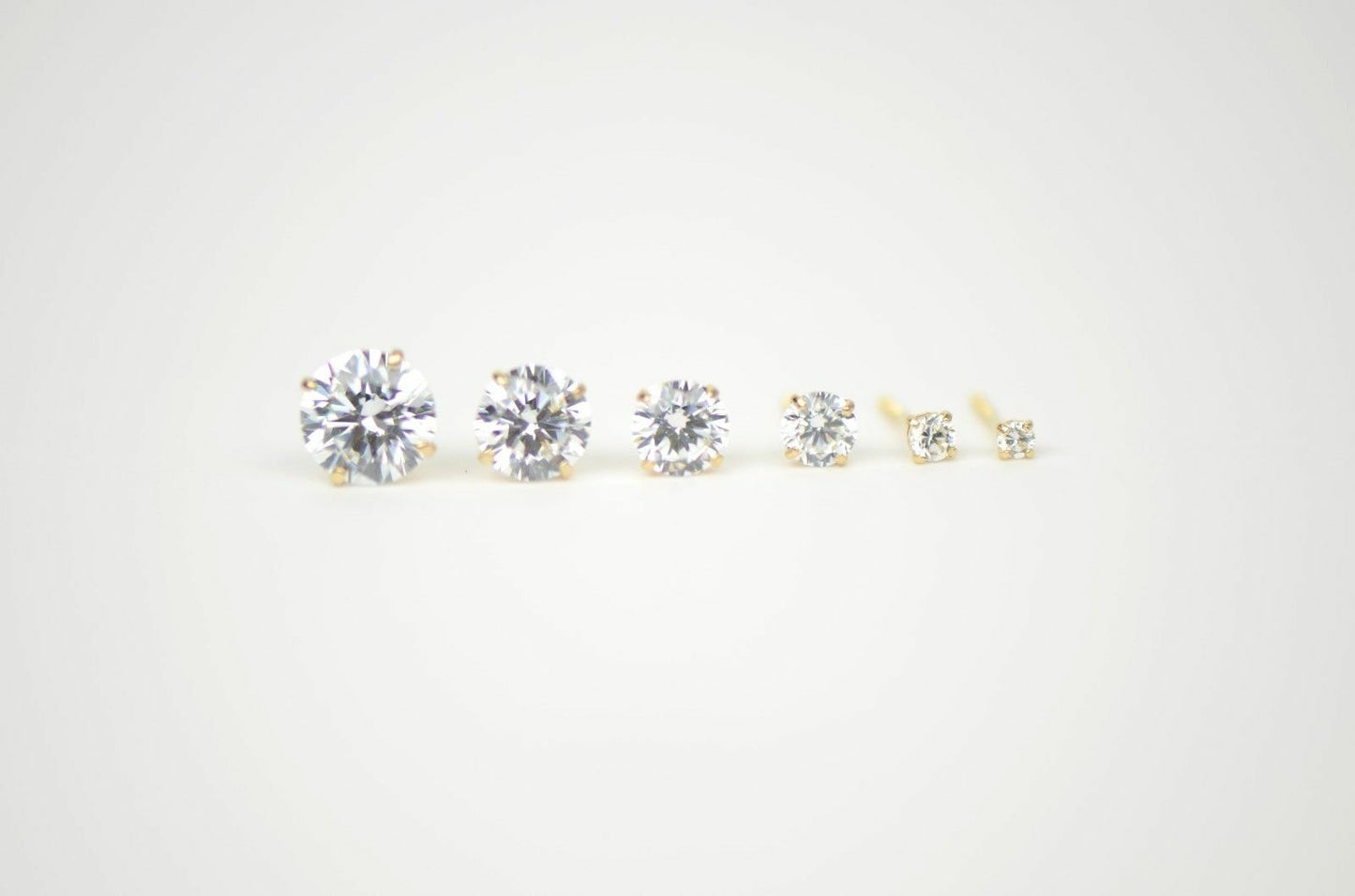 CZ Stud Earring Round cut in 14k yellow gold Screw back