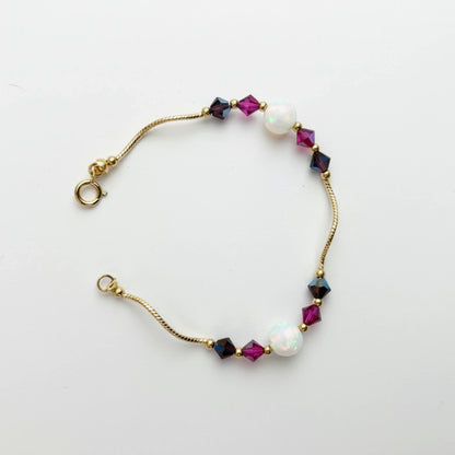14k Yellow Gold Baby Bracelet made with Opal and Crystals from Swarovski