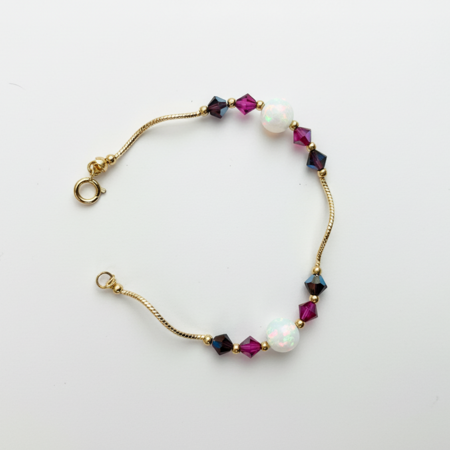 14k Yellow Gold Baby Bracelet made with Opal and Crystals from Swarovski