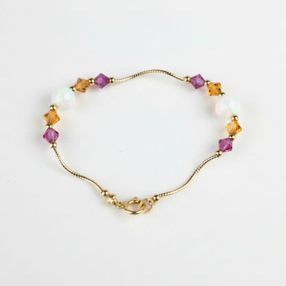 14k Yellow Gold Baby Bracelet made with Opal and Crystals from Swarovski