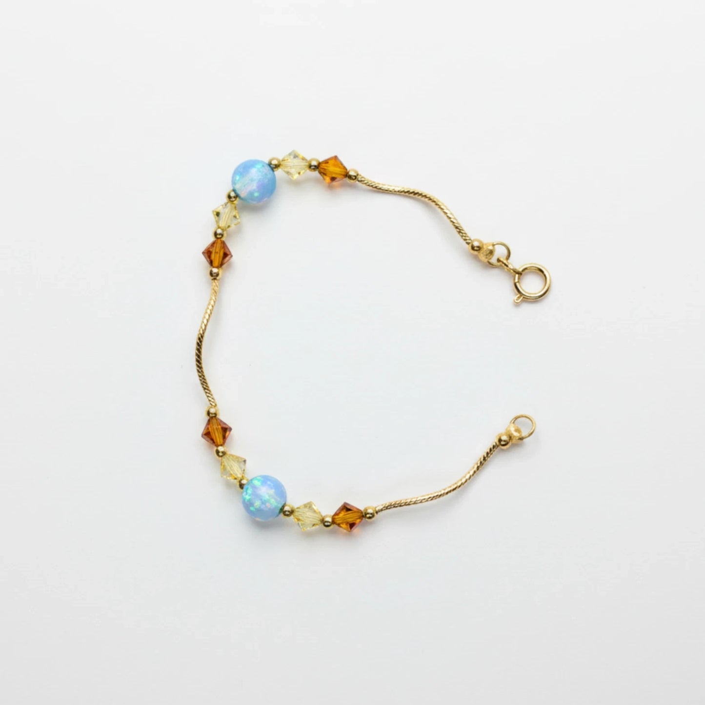 14k Yellow Gold Baby Bracelet made with Opal and Crystals from Swarovski