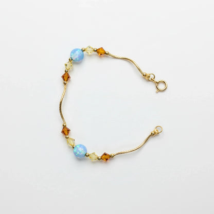 14k Yellow Gold Baby Bracelet made with Opal and Crystals from Swarovski