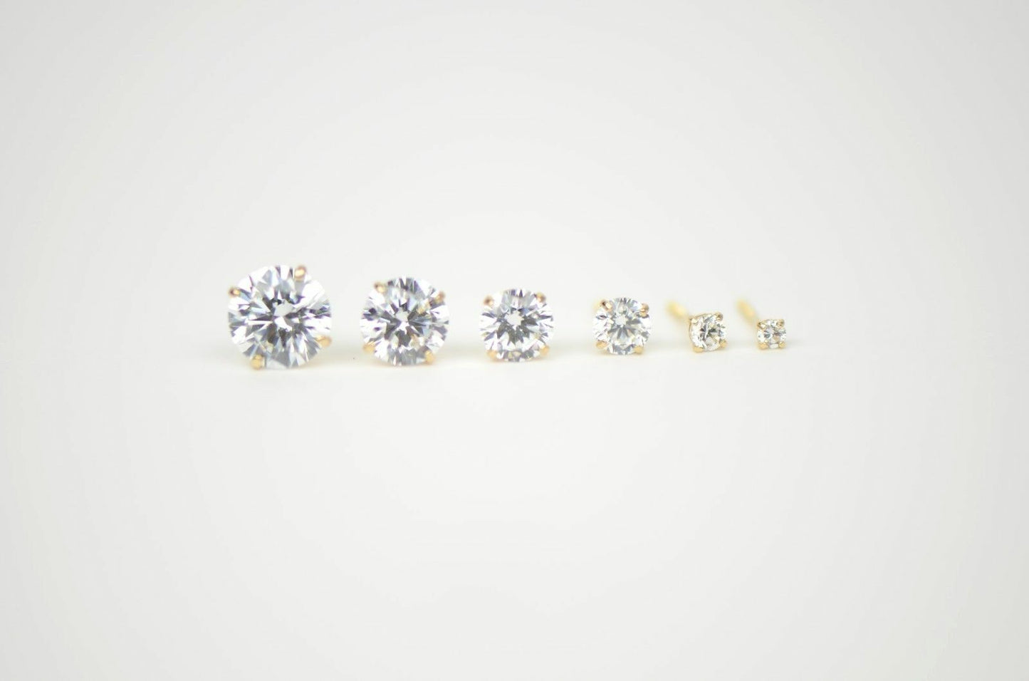 CZ Stud Earring Round cut in 14k yellow gold Screw back