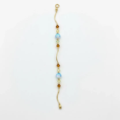 14k Yellow Gold Baby Bracelet made with Opal and Crystals from Swarovski