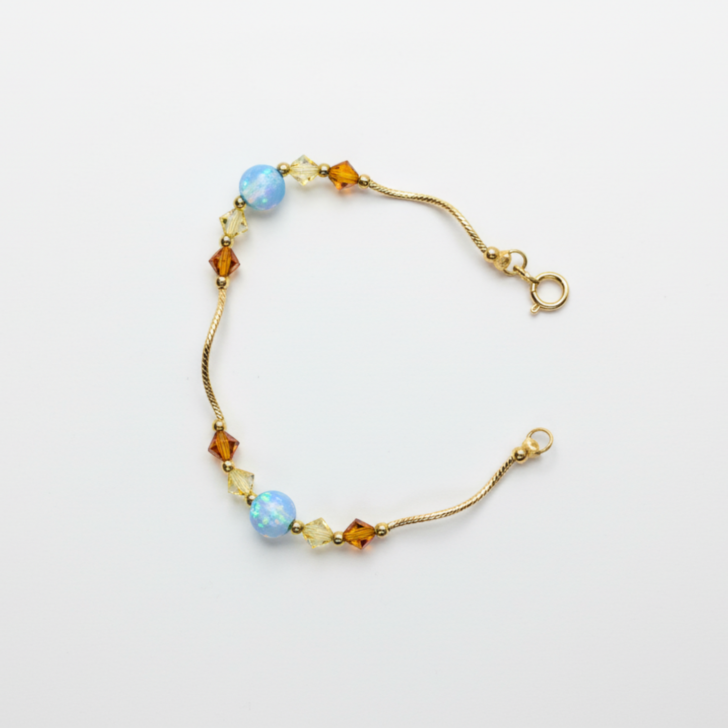 14k Yellow Gold Baby Bracelet made with Opal and Crystals from Swarovski