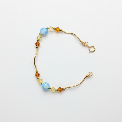 14k Yellow Gold Baby Bracelet made with Opal and Crystals from Swarovski