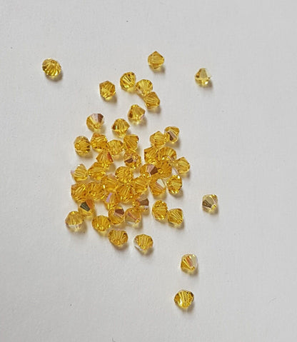 144x SWAROVSKI 5328 CRYSTAL AB 4mm BICONE XILION BEAD